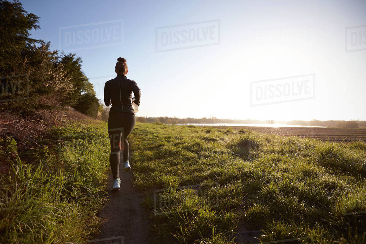 Woman On Early Morning Run In Countryside Royalty-free Stock