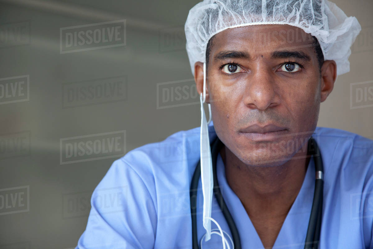 Black doctor in scrubs and surgical cap Stock Photo Dissolve