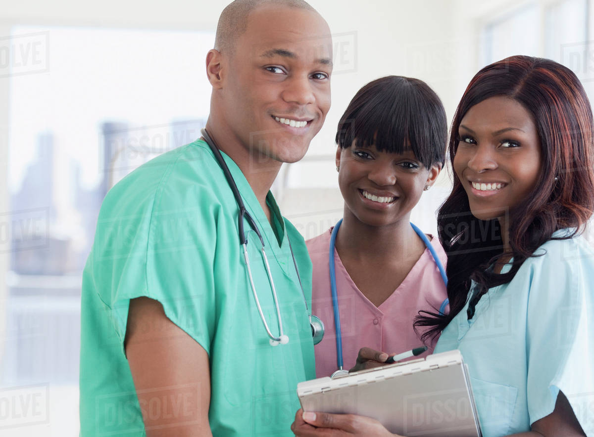 African doctor and nurses in hospital Stock Photo Dissolve