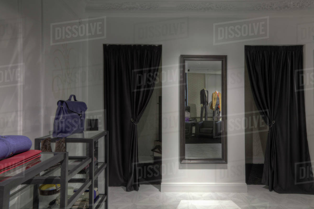 Dressing rooms and mirror in clothing store for men Stock Photo