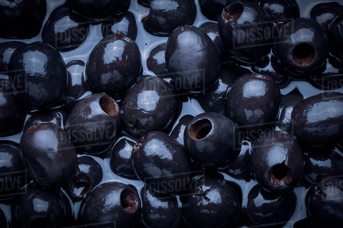 Black olives in liquid Stock Photo Dissolve