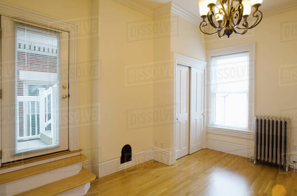 Empty Room In Apartment With Hardwood Floor And Heater Stock Photo Empty Room In Apartment With Hardwood Floor And Heater