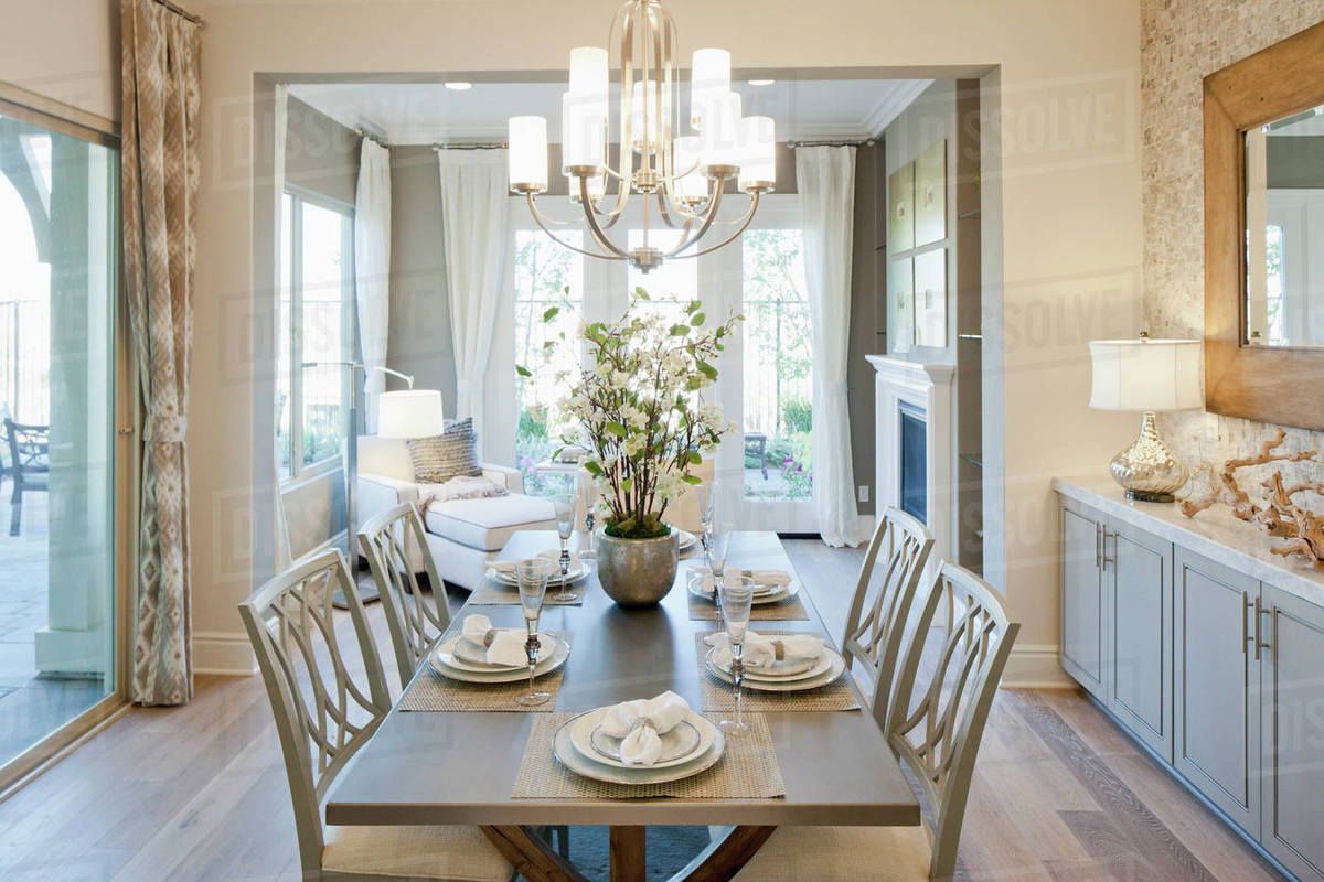 Chandelier over dining table Stock Photo Dissolve