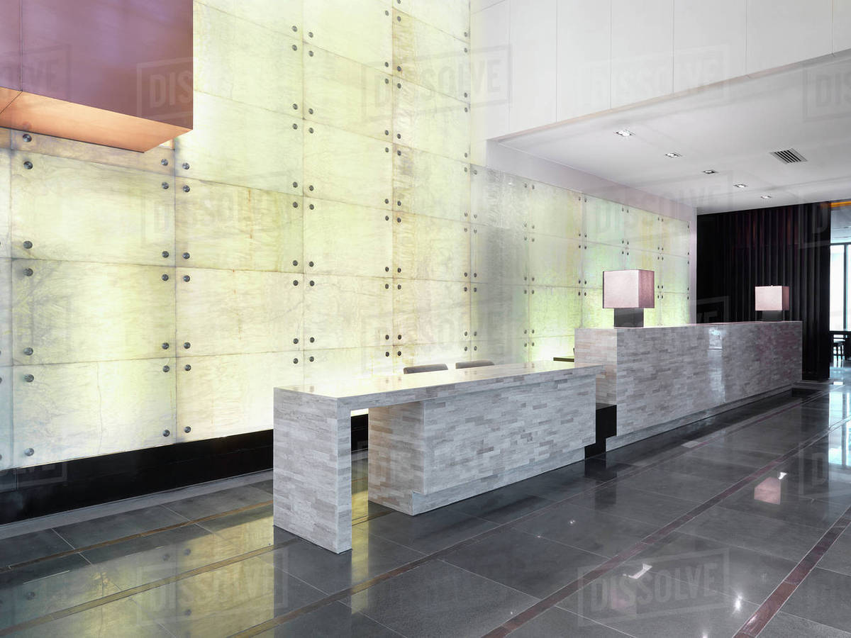 Marble Reception Desk In Modern Lobby Stock Photo