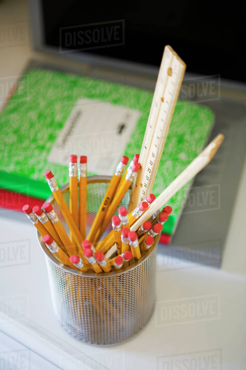 Full pencil container on desk Stock Photo Dissolve