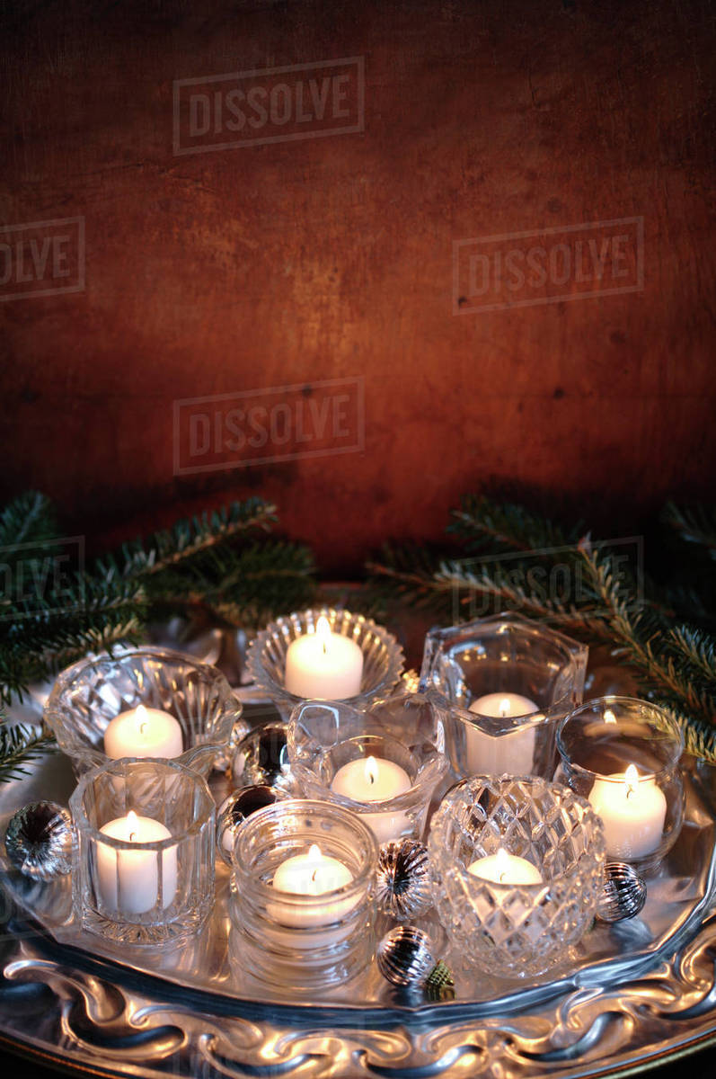 Group of burning votive candles Stock Photo Dissolve