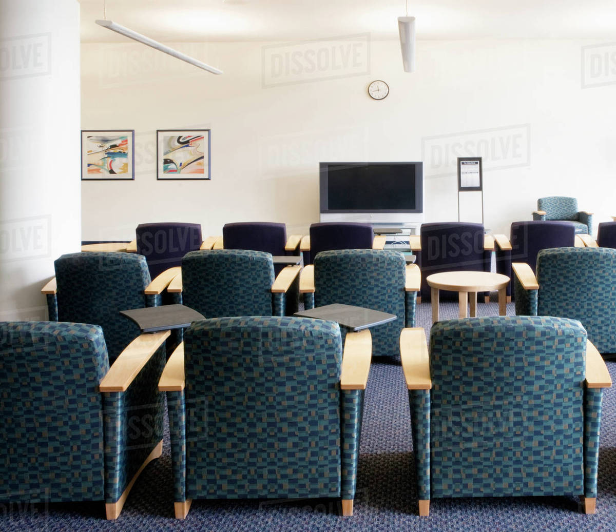 Chairs and television in lounge Stock Photo Dissolve
