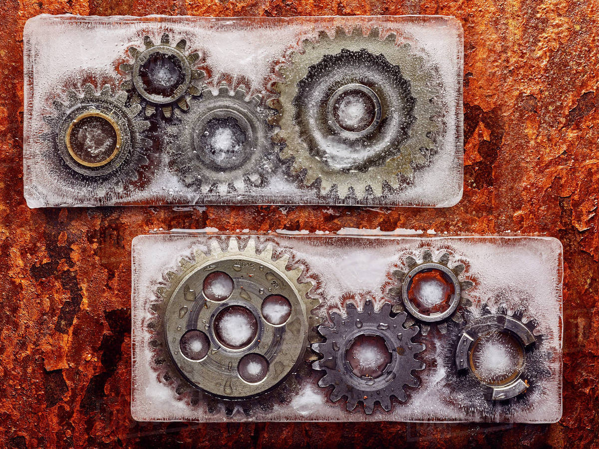 Gears frozen in ice Stock Photo Dissolve