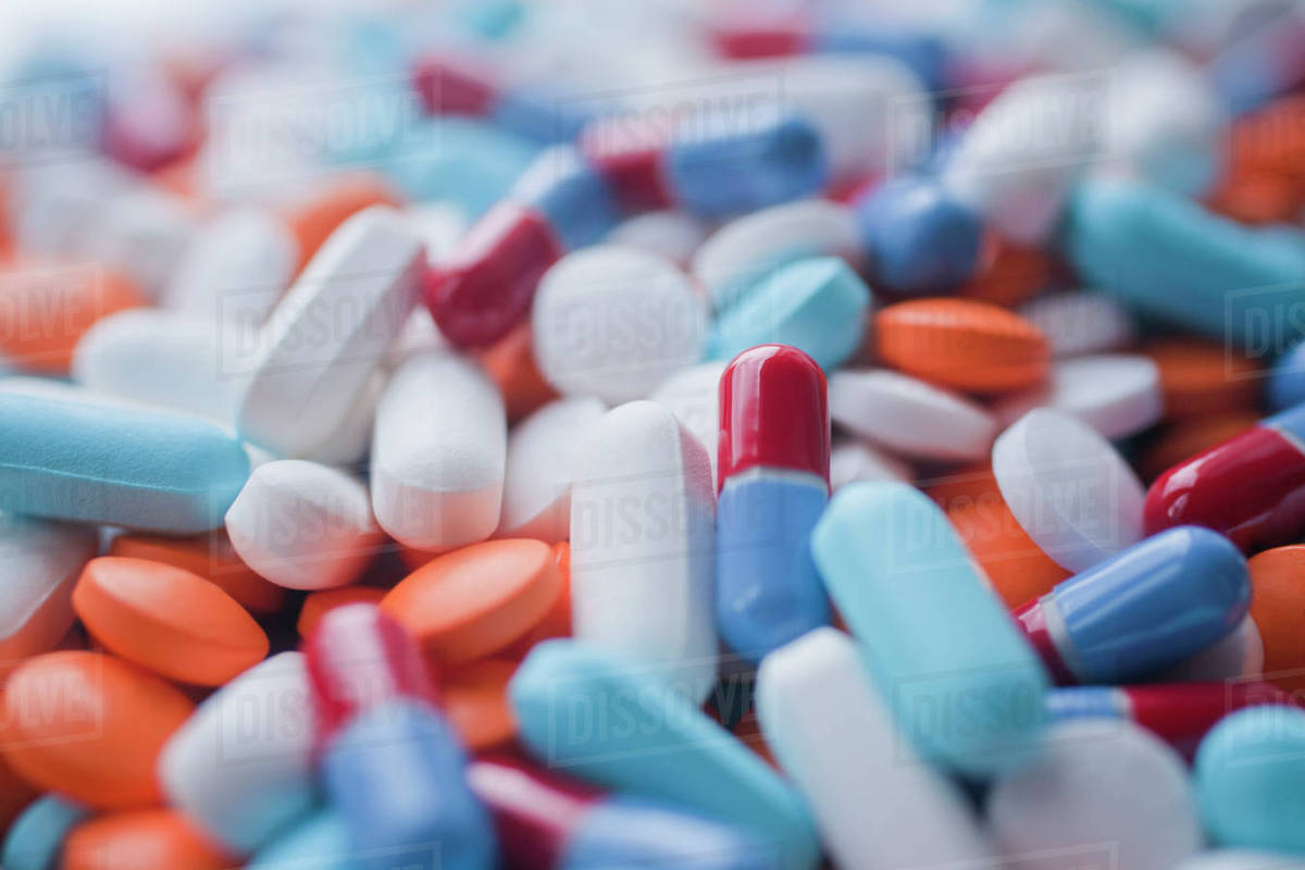 Variety of pills and capsules Stock Photo Dissolve