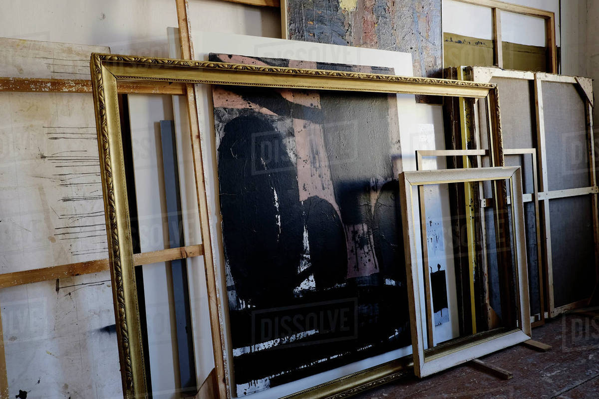 Paintings And Frames Leaning On Wall Stock Photo Dissolve Paintings And Frames Leaning On Wall