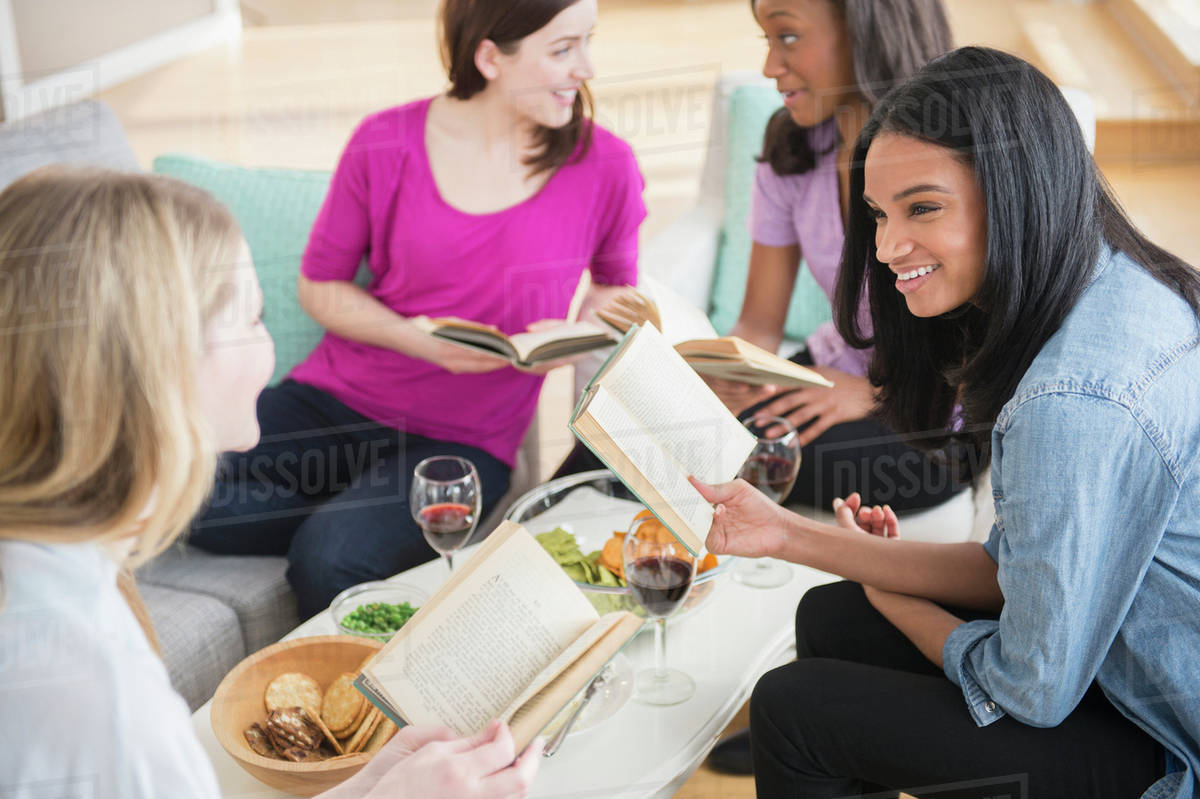 friends-discussing-books-together-stock-photo-dissolve