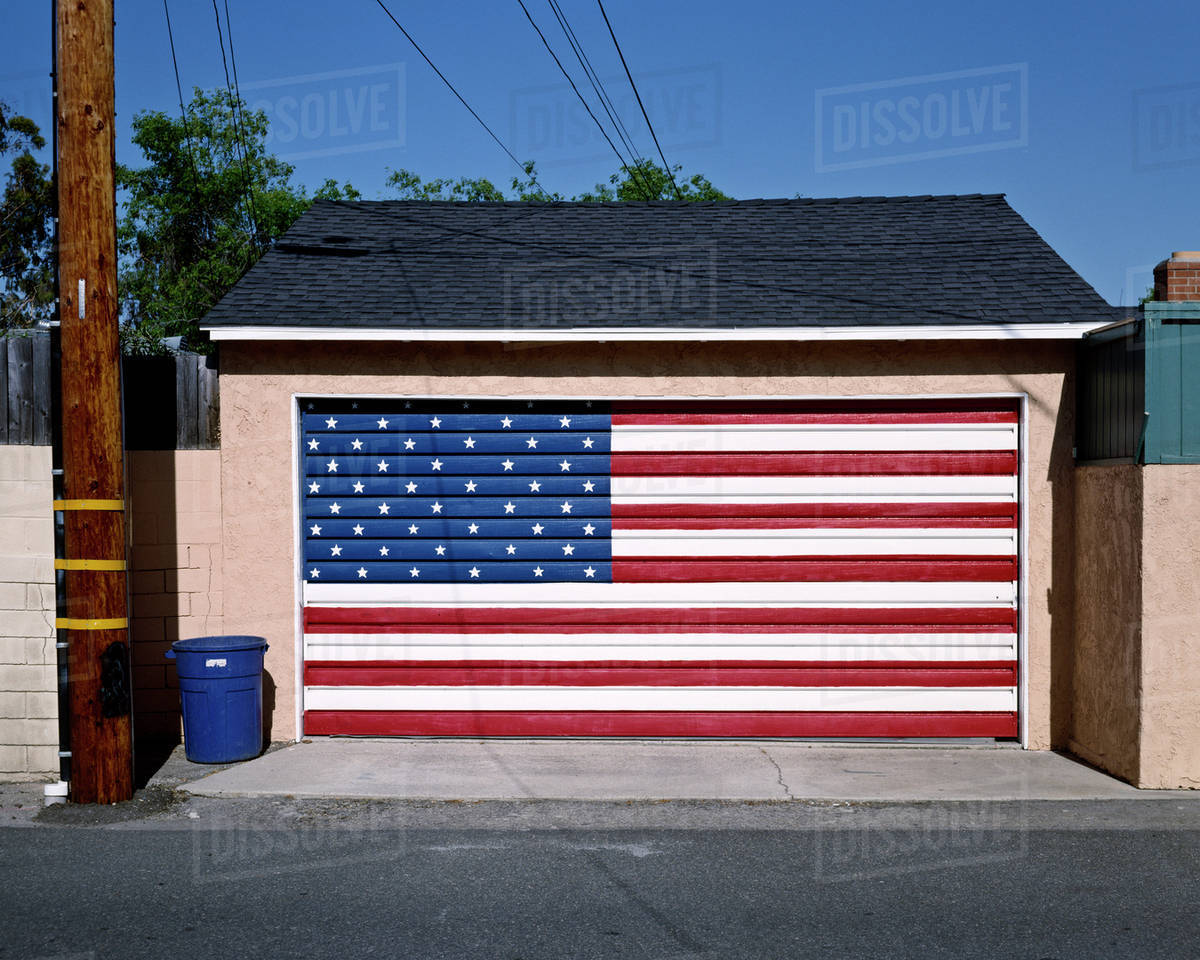 American flag painted on garage door Stock Photo Dissolve