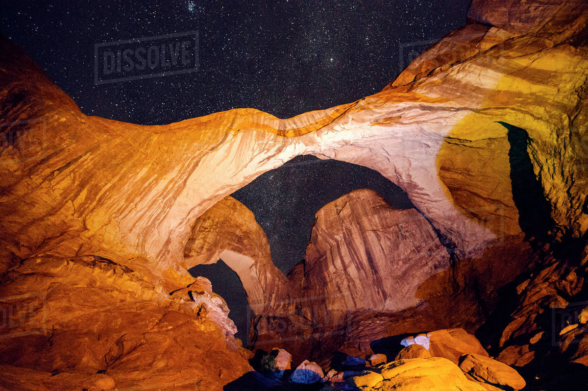 Illuminated rocks at night in Arches National Park, Moab, Utah, United