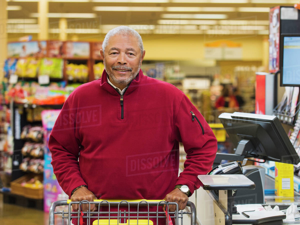 African American customer at grocery store checkout Stock Photo