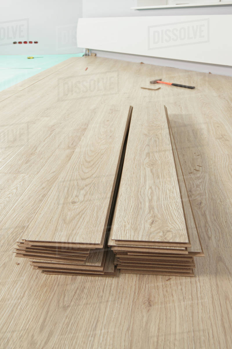 Rolls of underlay, or subflooring material, and a partly installed