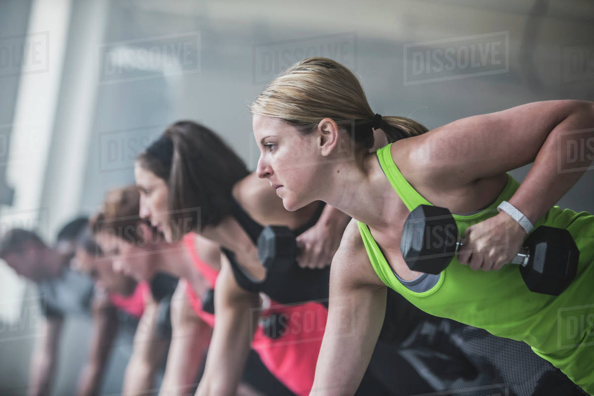 Athletes doing pushups and lifting weights Stock Photo Dissolve