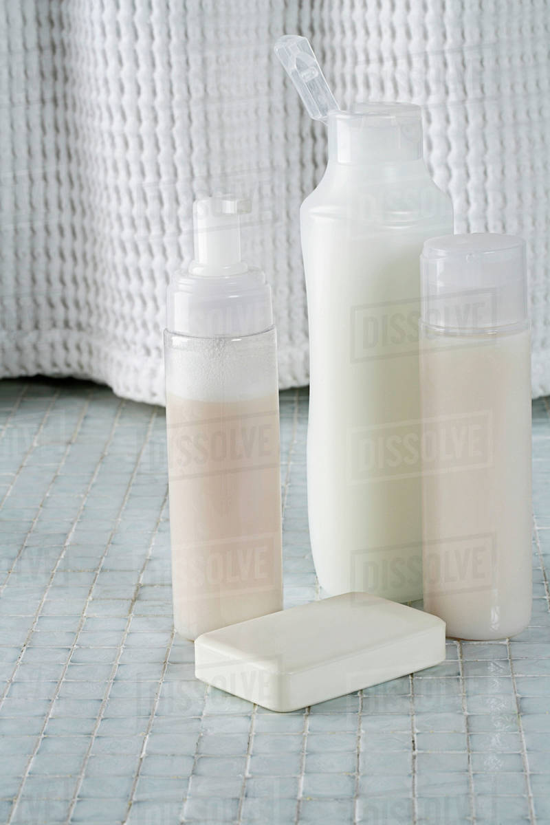 Soap and bottles shampoo, conditioner and shower gel Stock Photo