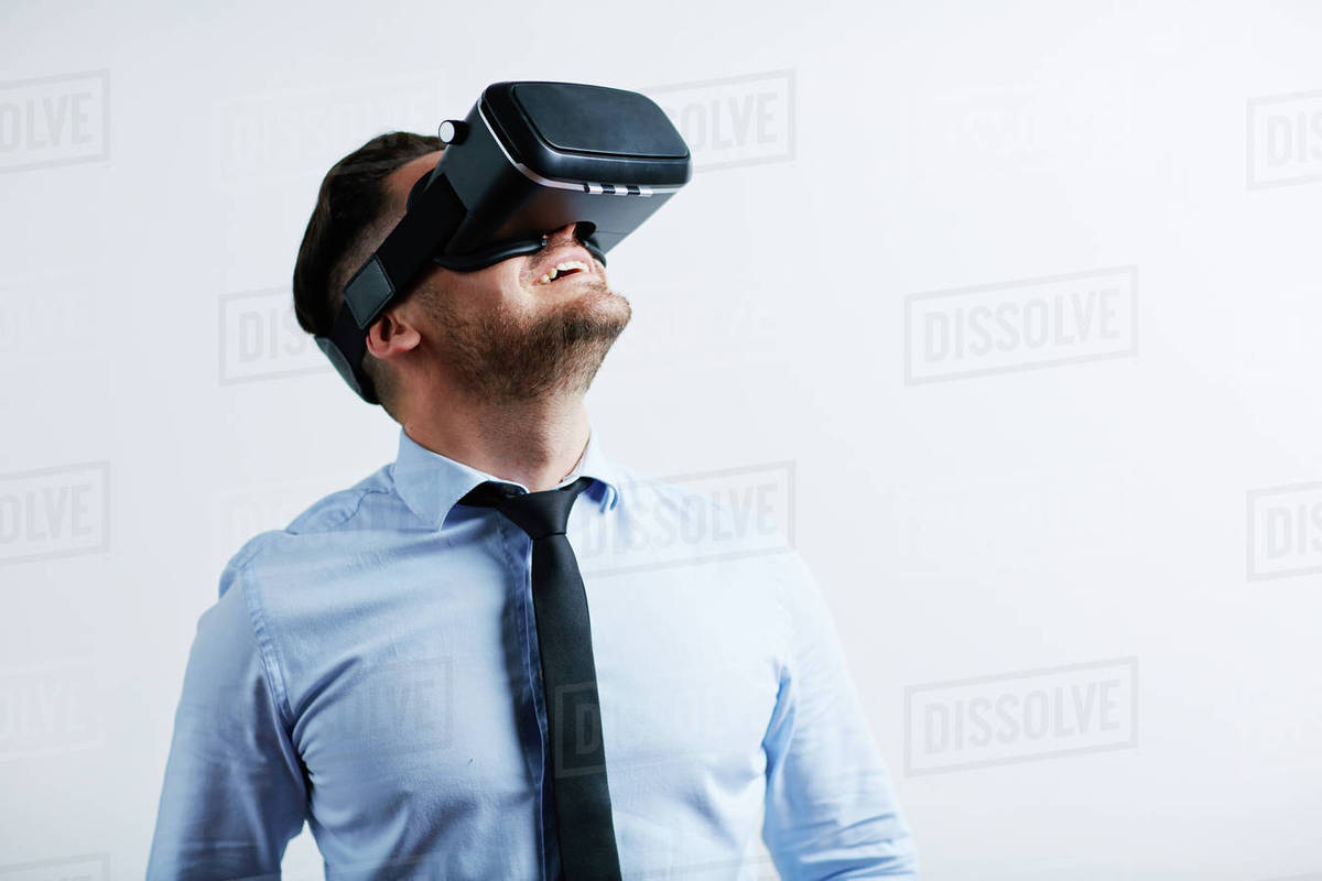 Businessman enjoying virtual reality with simulator Royalty-free stock photo