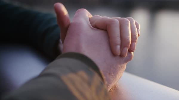 Couple Holding Hands Whilst Walking In The City At Night Stock - 600x338 - jpeg Women Hands Coming Together