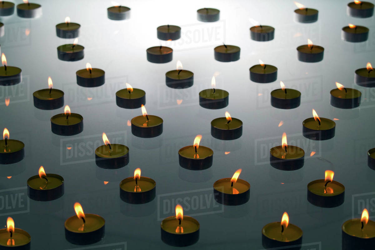 Burning tea lights Stock Photo Dissolve