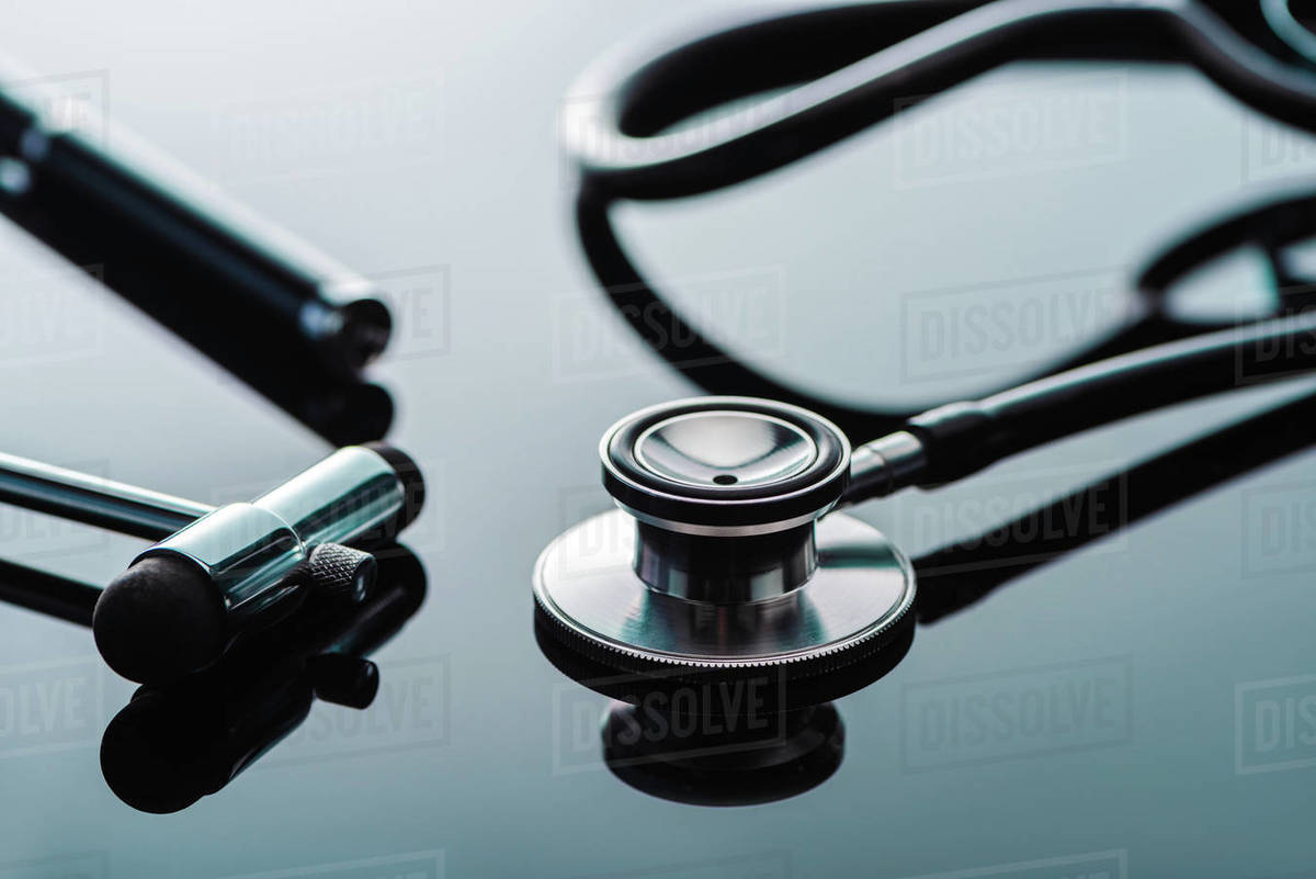 selective focus of stethoscope and reflex hammer on glass surface