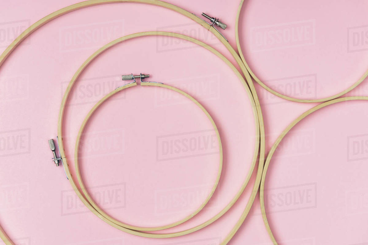 Flat Lay With Wooden Embroidery Hoops Arranged On Pink Background Flat Lay With Wooden Embroidery Hoops Arranged On Pink Background