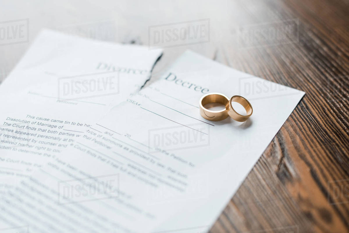 engagement shot teared and on rings Close-up D2115_172_275 of decree divorce