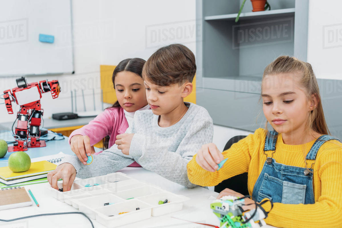 Schoolchildren working on robot programming at stem class - Royalty ...