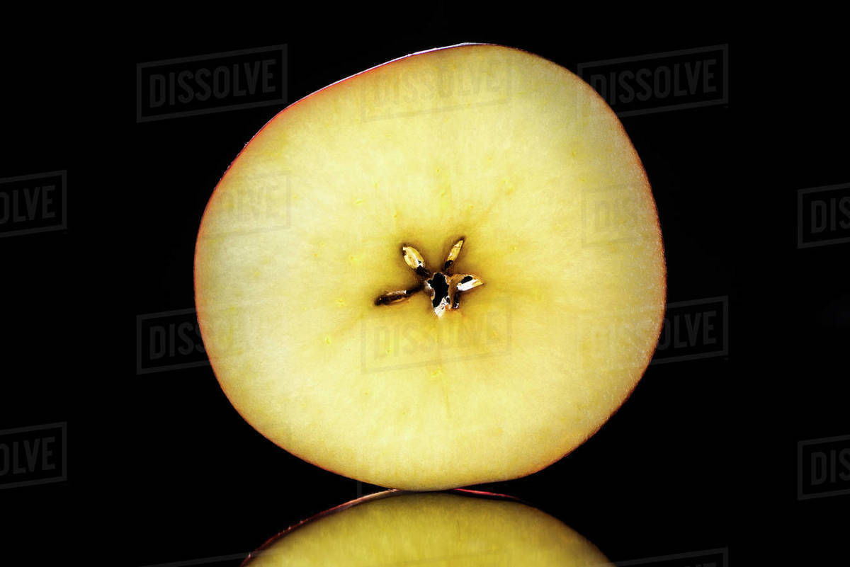 Half of ripe raw apple isolated on black - Royalty-free Stock Photo ...