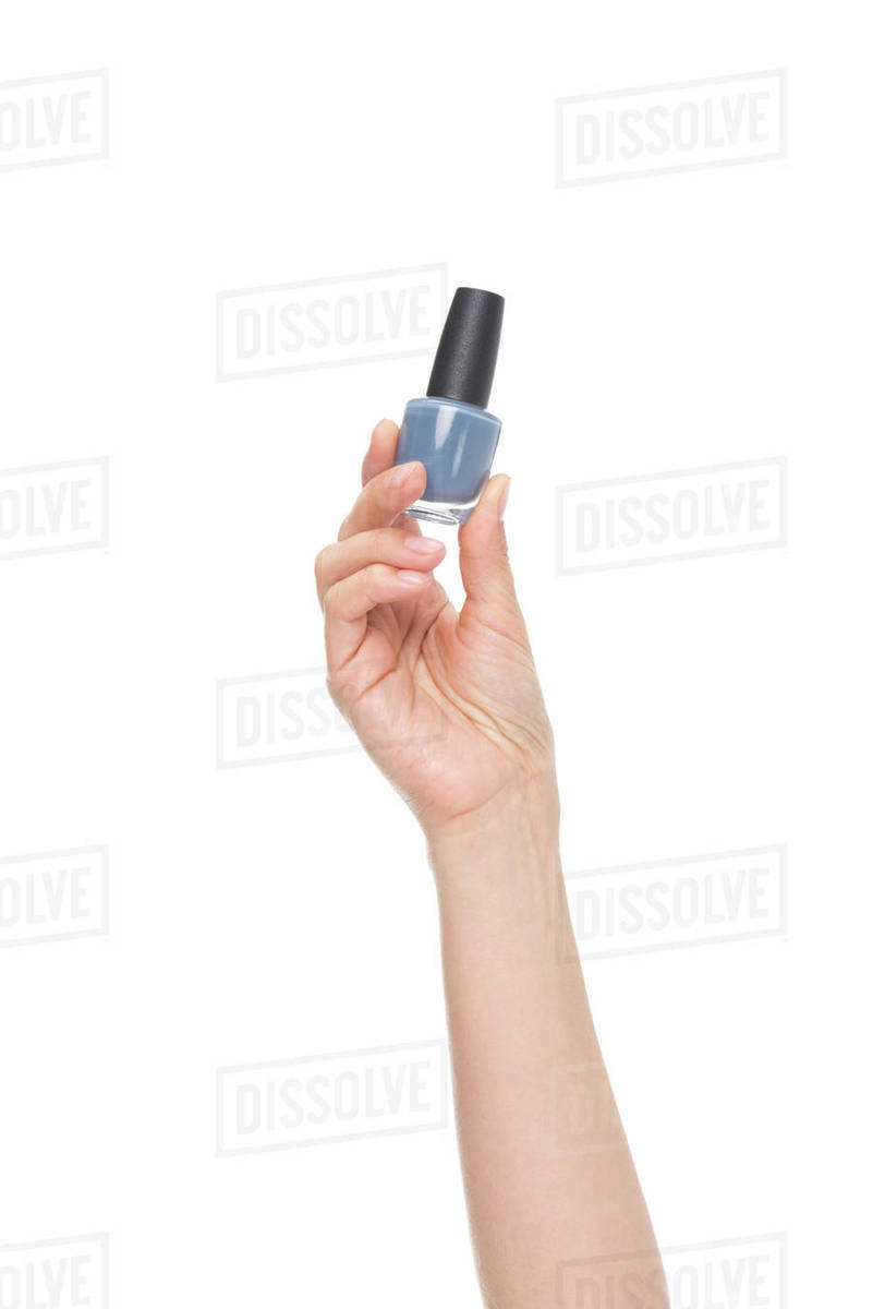 Cropped shot of female hand showing nail polish isolated on white