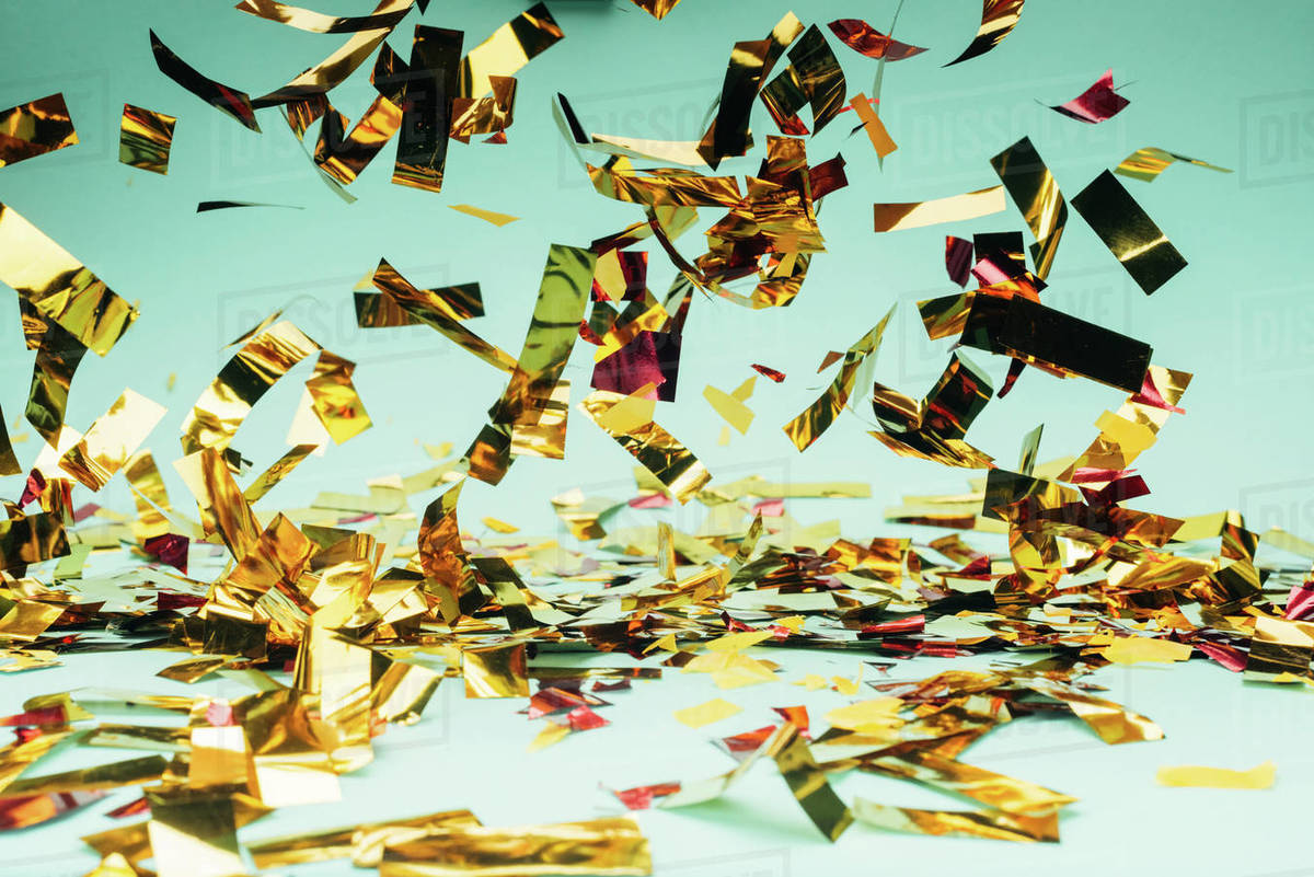 Closeup shot of beautiful glossy falling confetti Stock Photo Dissolve