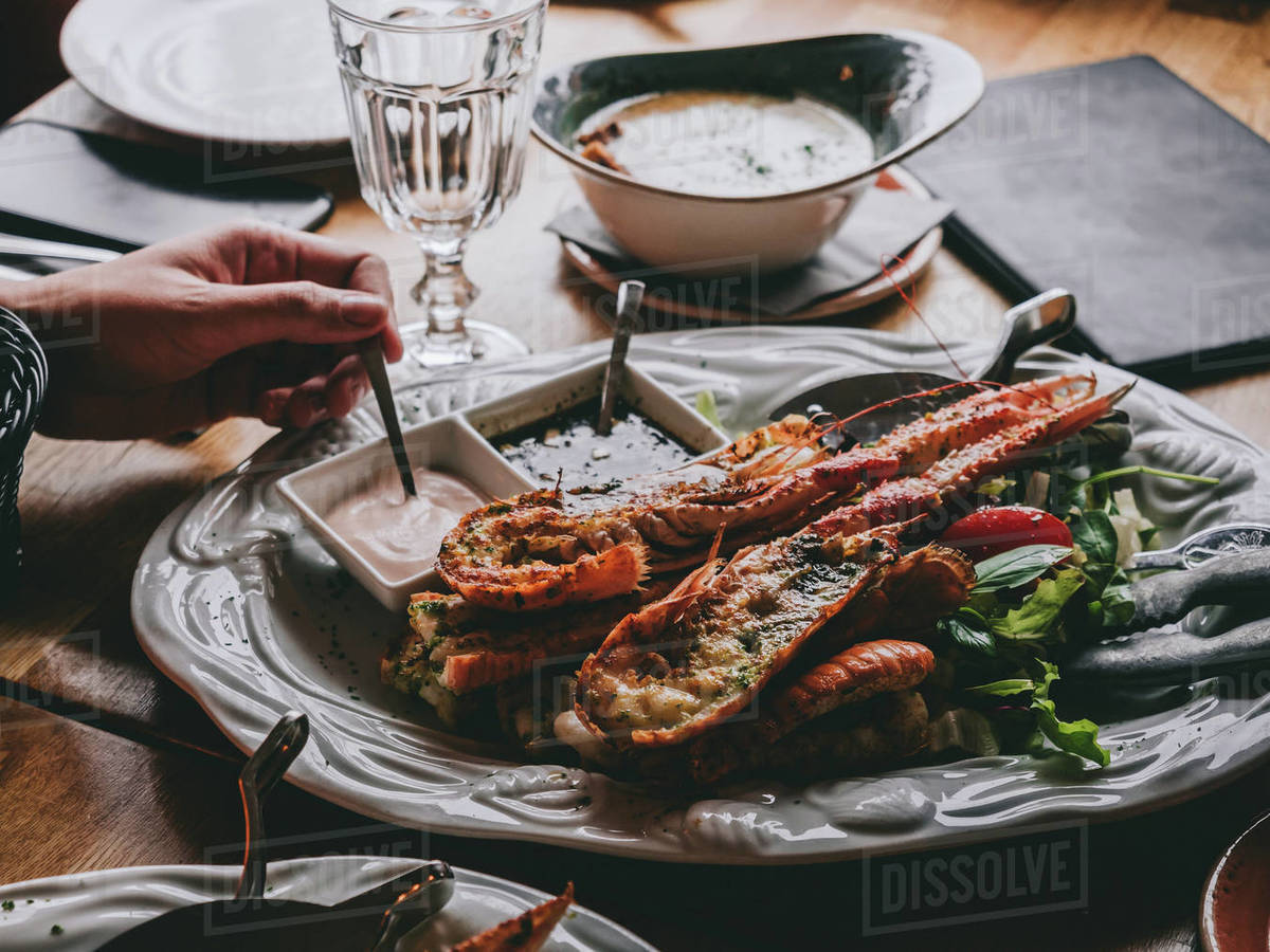 Dish with langoustine on salad with sauces in restaurant in Hofn