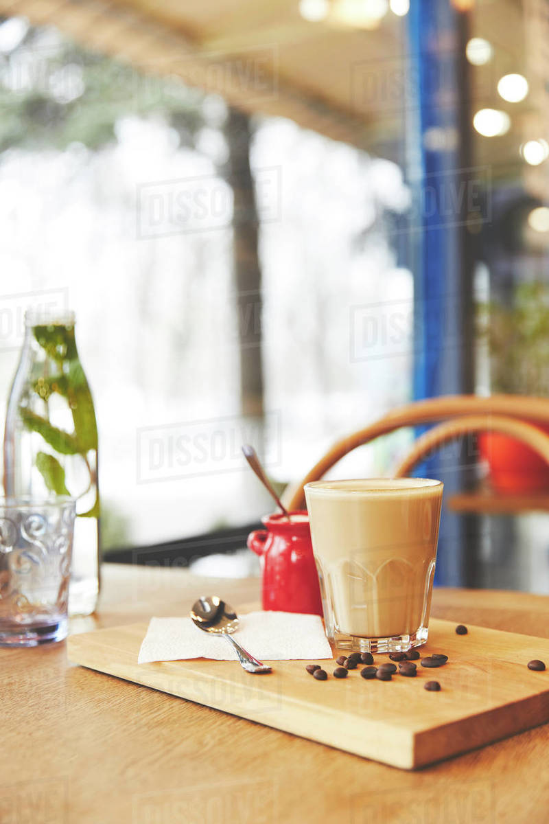 Restaurant table with coffee served in glass Stock Photo Dissolve