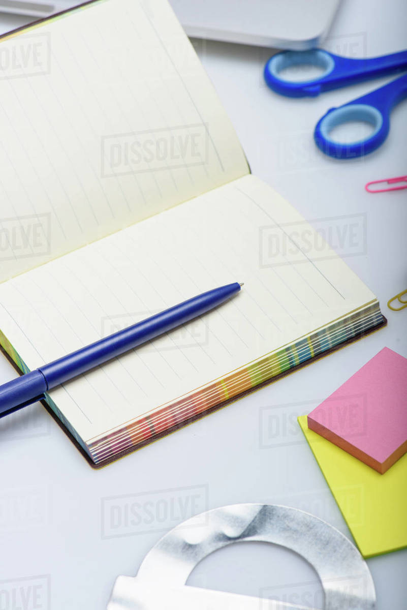 Empty copybook and different school supplies isolated on white ...