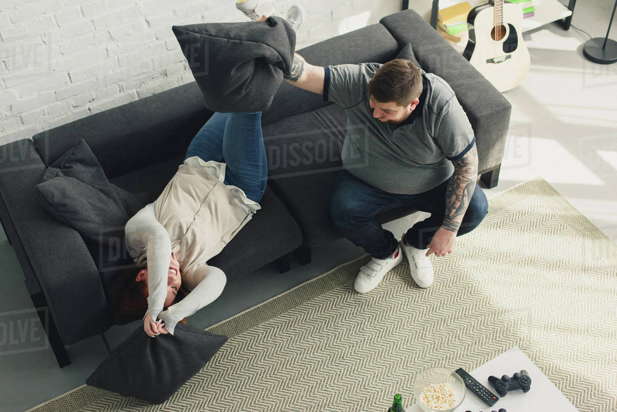 High Angle View Of Overweight Boyfriend And Girlfriend Fighting