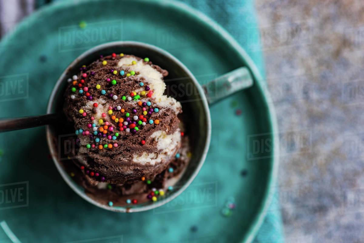Overhead view of homemade chocolate ice cream with sprinkles Stock Photo Dissolve