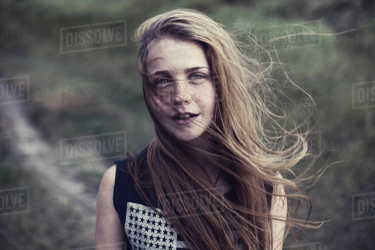 Portrait of a girl with long hair blowing in the wind - Stock Photo ...