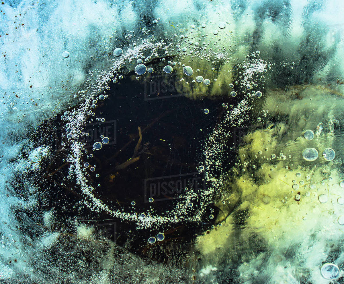 Air bubbles in ice Stock Photo Dissolve