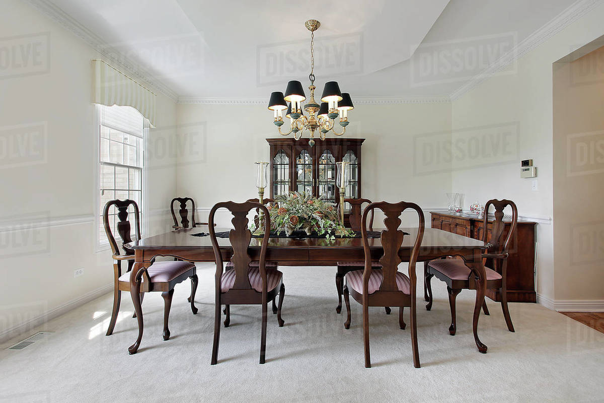 Traditional formal dining room with white carpeting Stock Photo