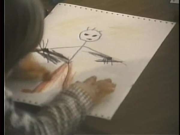 Rear view of child drawing on paper - Stock Video Footage - Dissolve