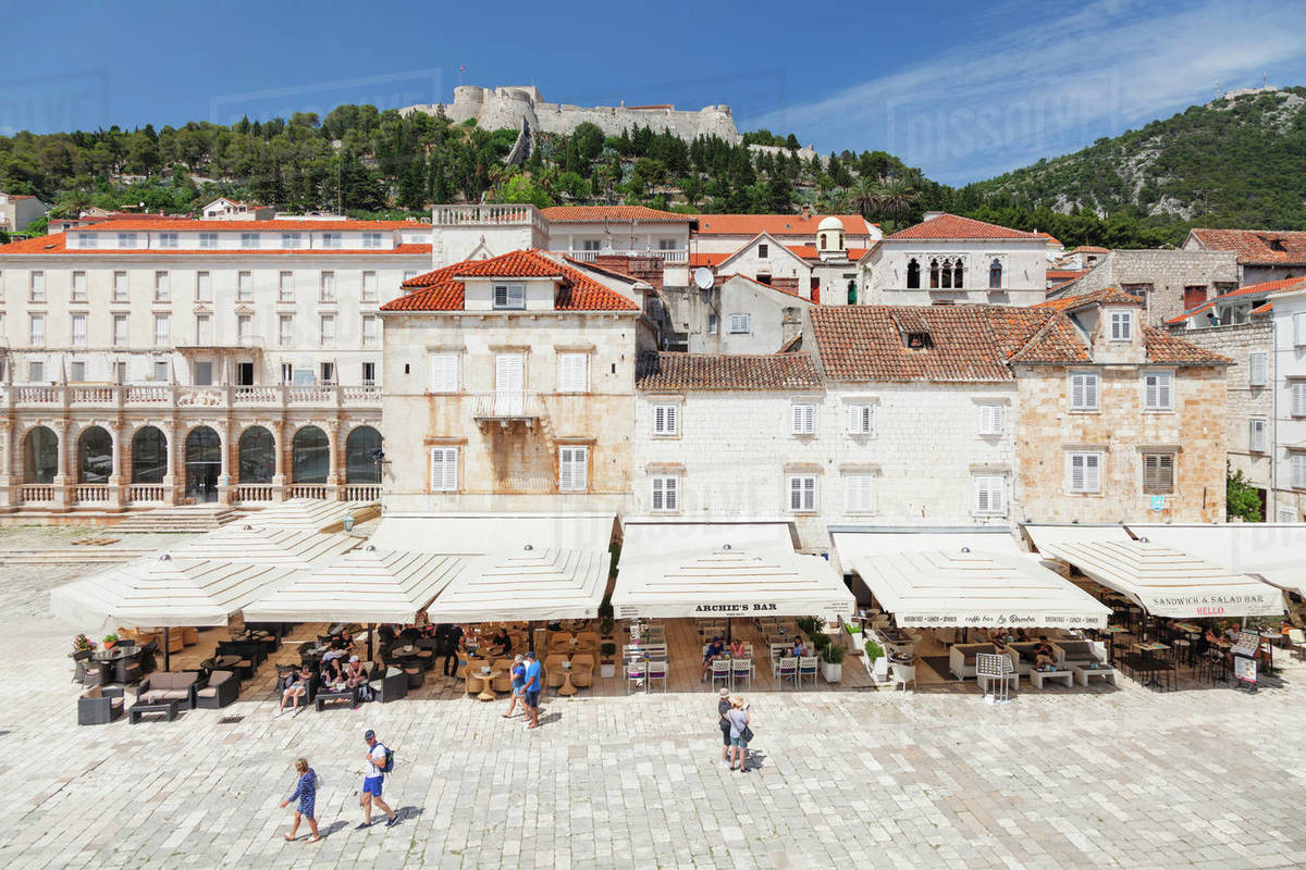 Restaurants at the Main Square, view to Spanisch Fortress, Hvar, Hvar Island, Dalmatia, Croatia, Europe Royalty-free stock photo