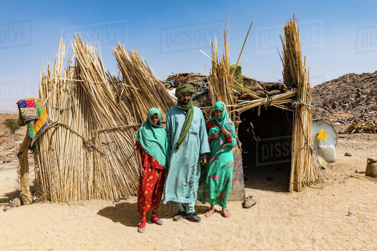 Tuareg family posing in front of their hut, near Tamanrasset, Algeria, North Africa, Africa Royalty-free stock photo