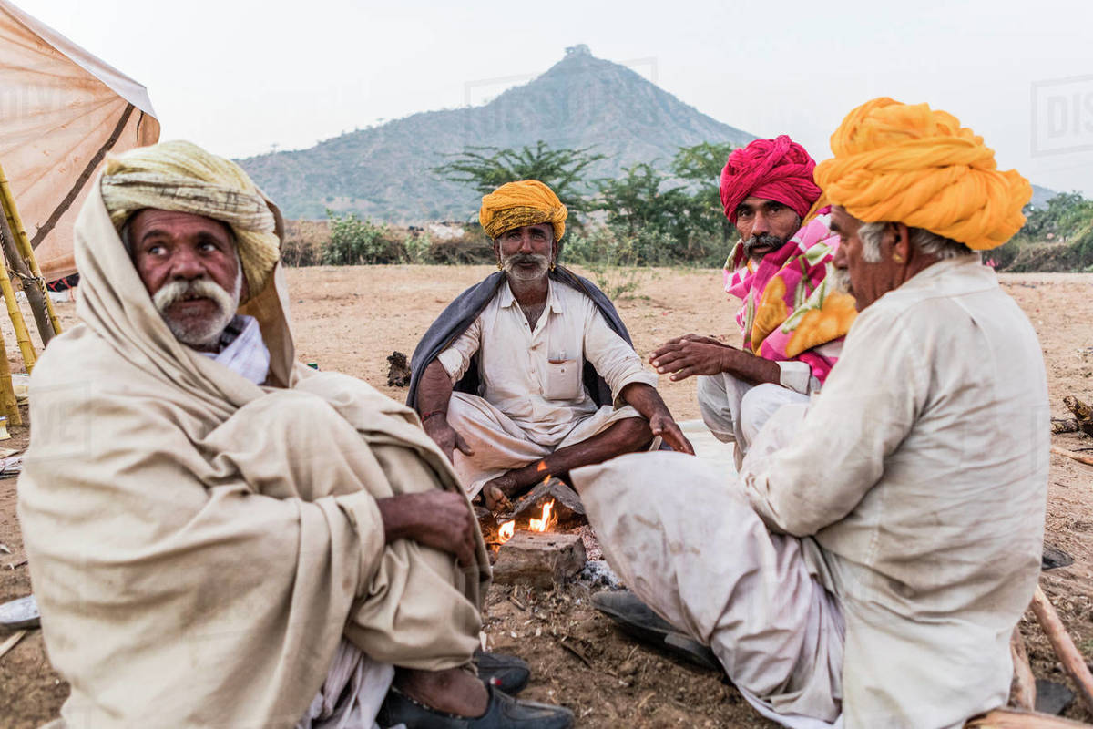 Camel herders early in the morning at the Pushkar Camel Fair, Pushkar, Rajasthan, India, Asia Royalty-free stock photo