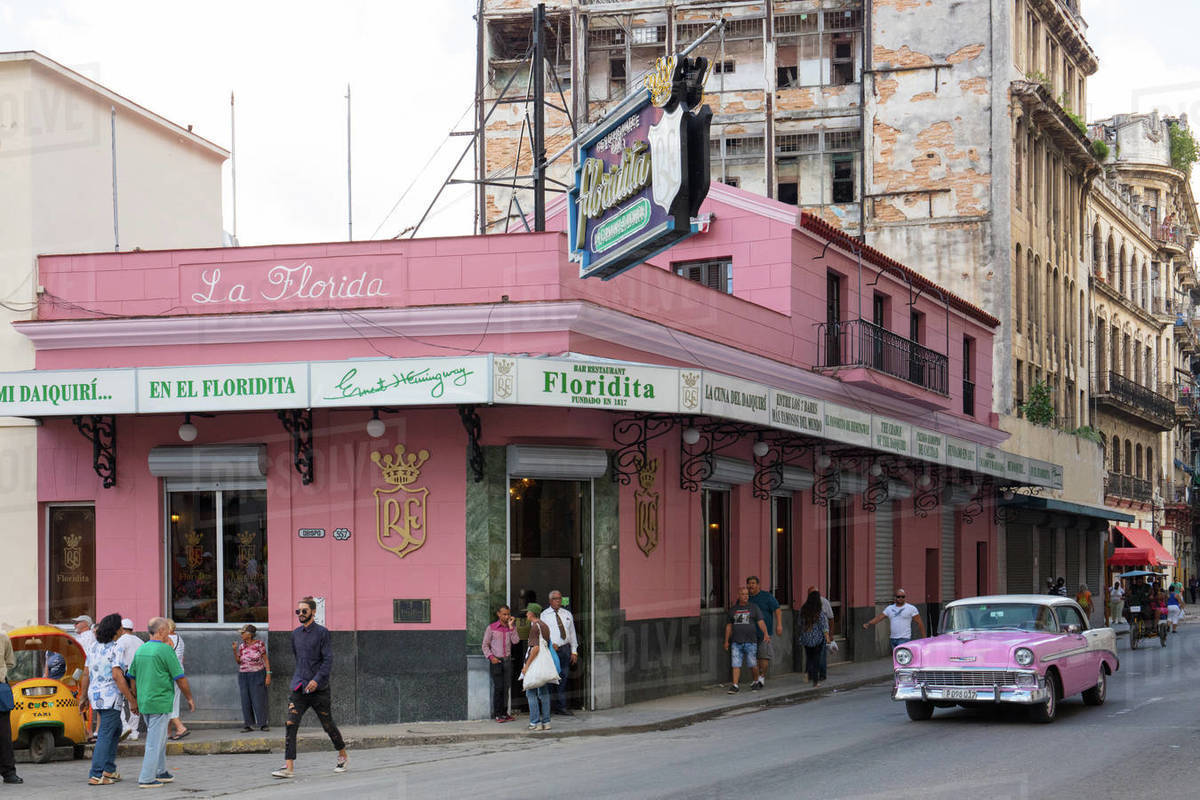 Pink vintage American car outside Floridita bar, Havana, Cuba, West Indies, Caribbean, Central America Royalty-free stock photo