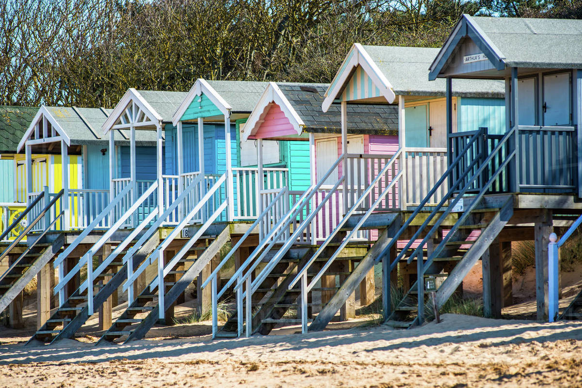 Colourful beach huts on Wells beach at Wells next the Sea on North Norfolk coast, Norfolk, East