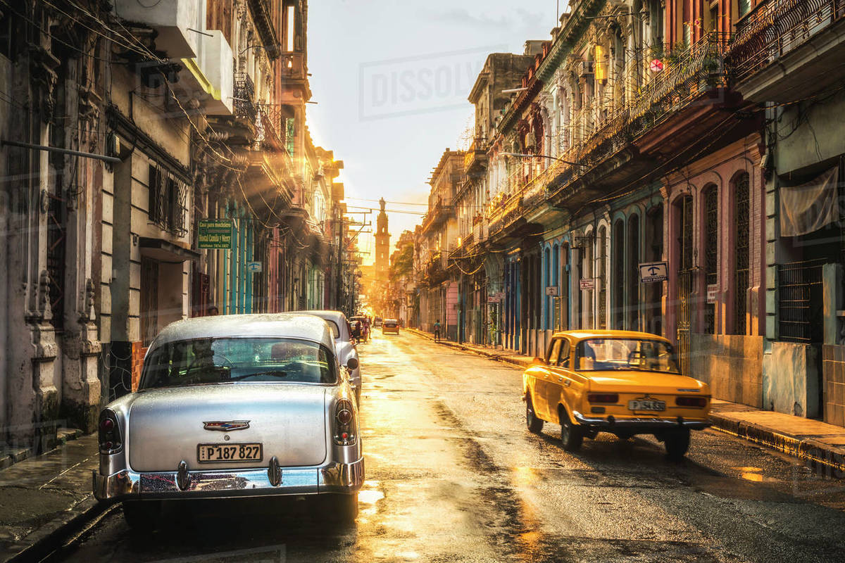 American and Russian vintage cars at sunset, La Habana (Havana), Cuba, West Indies, Caribbean, Central America Royalty-free stock photo