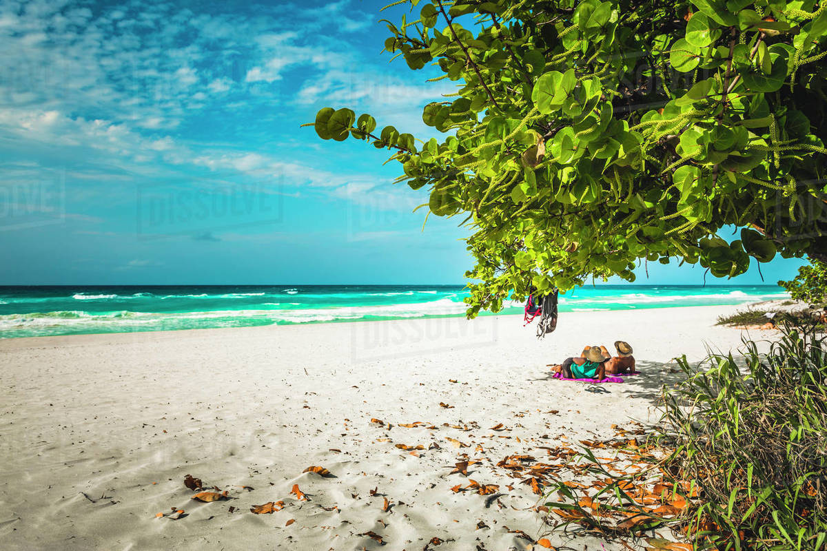 Tourists looking into the sea from Varadero beach, Hicacos Peninsula, Matanzas Province, Cuba, West Indies, Central America Royalty-free stock photo