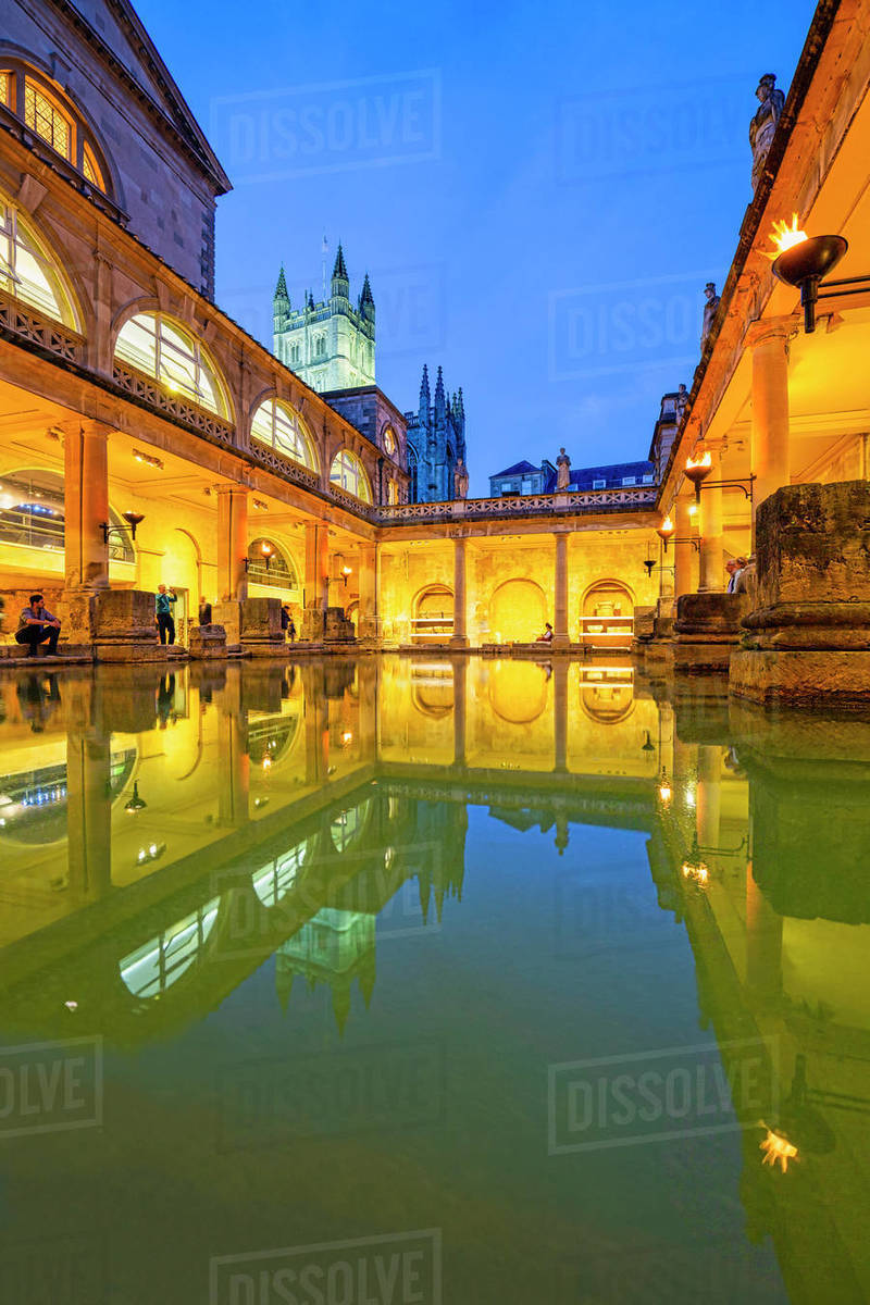 The Roman Baths and Bath Abbey illuminated at dusk, UNESCO World ...