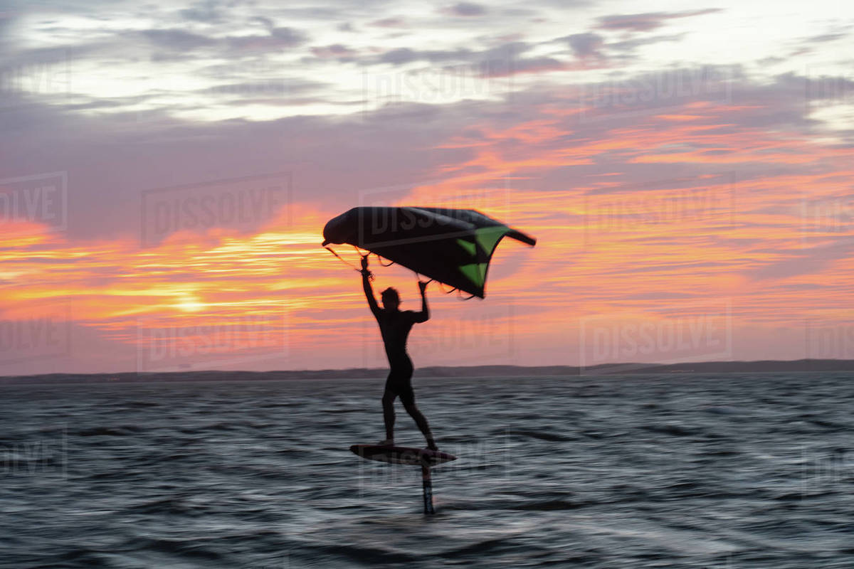 Pro surfer James Jenkins on his wing surfer flies across the Pamlico