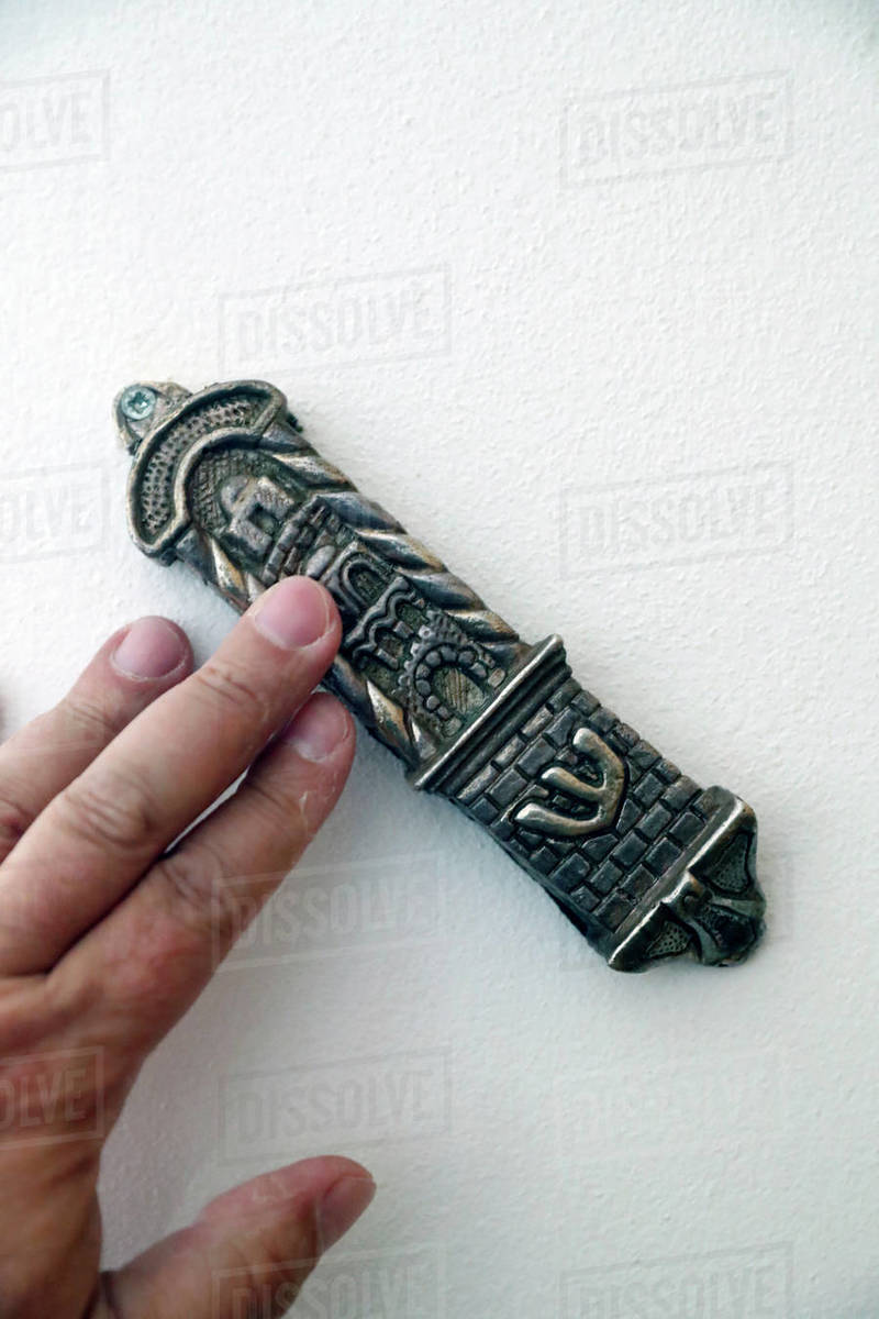 Mezuzah, a piece of parchment inscribed with specified Hebrew verses